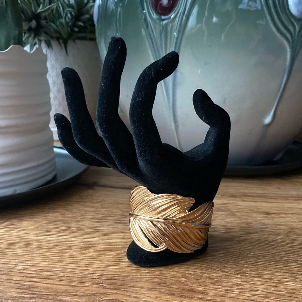 Gold tone Stella & Dot feather cuff bracelet